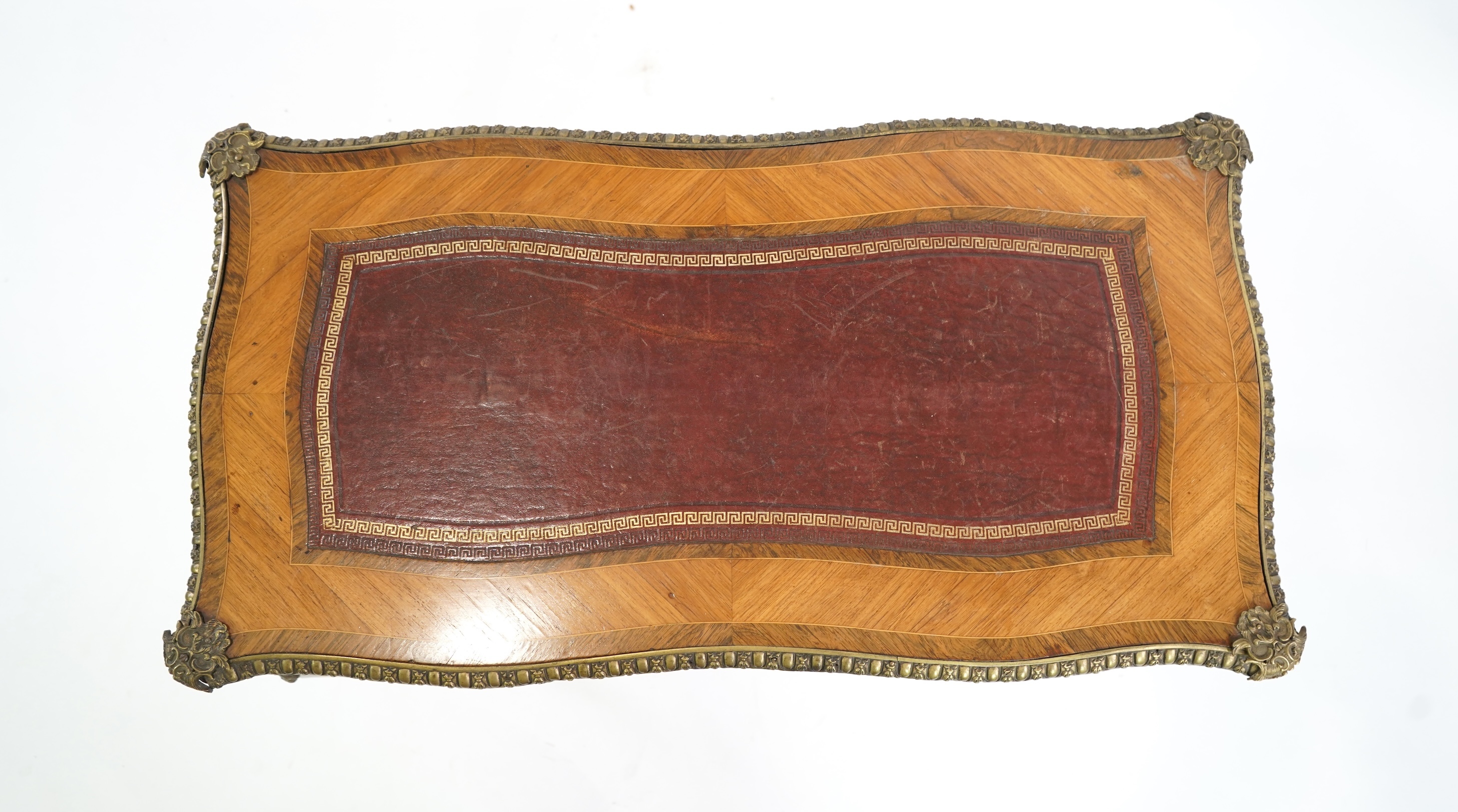 A small Louis XV style gilt metal mounted rosewood and kingwood bureau plat